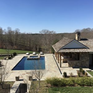 Residential pool and cabana with stone supplied by Fieldstone Center and installed by The Rock Masonry Company